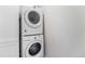 Efficient laundry area features stacked washer and dryer maximizing space in a compact design at 4760 Kittredge St, Denver, CO 80239