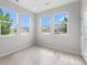 Bright living room with luxury vinyl flooring and large windows offering ample natural light at 4760 Kittredge St, Denver, CO 80239