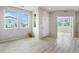 Inviting living room with large windows, light hardwood floors, and neutral paint creating a bright atmosphere at 4760 Kittredge St, Denver, CO 80239
