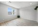 Spacious living room with neutral paint, laminate flooring, and plenty of natural light at 4760 Kittredge St, Denver, CO 80239