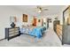 Spacious bedroom featuring a ceiling fan, carpet, and a walk-in closet at 710 S Alton Way # 5A, Denver, CO 80247
