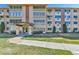 Inviting condo building featuring well-maintained landscaping and an attractive facade near a manicured lawn at 710 S Alton Way # 5A, Denver, CO 80247