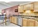 Kitchen with stainless steel appliances, updated countertops, and an eat-in area at 710 S Alton Way # 5A, Denver, CO 80247