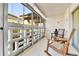 Enclosed sunroom filled with light, featuring chairs for relaxation and enjoyment of the views at 710 S Alton Way # 5A, Denver, CO 80247