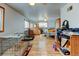 Spacious bedroom with hardwood floors, ample natural light, ceiling fans, and room for relaxation and personalization at 1256 Ulster St, Denver, CO 80220