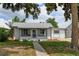 Charming single-story home with a well-maintained front yard and a cozy, enclosed porch at 1256 Ulster St, Denver, CO 80220