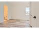 Bright, minimalist bedroom with light wood floors and ample natural light at 11442 Autumn Moon St, Littleton, CO 80125
