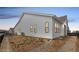 Side view of a single-Gathering home featuring horizontal siding and black trim windows at 11442 Autumn Moon St, Littleton, CO 80125