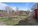 Expansive backyard featuring lush greenery and scenic views of the surrounding landscape at 96 Greeley Blvd, Palmer Lake, CO 80133