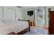 Serene bedroom featuring a comfortable bed, closet, and a large window with scenic outdoor views at 96 Greeley Blvd, Palmer Lake, CO 80133