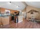 Kitchen with oak cabinets, stainless appliances, breakfast bar, and open to dining space at 96 Greeley Blvd, Palmer Lake, CO 80133