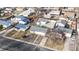 Aerial view of home with long driveway, garage, and street parking in neighborhood at 1345 S Meade St, Denver, CO 80219