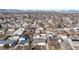 Expansive aerial view of a residential neighborhood with mountain views in the distance, perfect for families at 1345 S Meade St, Denver, CO 80219