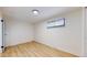 Clean bedroom with a window and light-colored laminate flooring at 1345 S Meade St, Denver, CO 80219