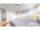 Bedroom with neutral walls, hard wood floors, and natural light from a window at 1345 S Meade St, Denver, CO 80219