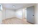 Neutral bedroom showcasing generous closet space and modern, light-colored laminate flooring at 1345 S Meade St, Denver, CO 80219