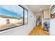 Entryway with a view to backyard and mini fridge with light wood floor at 1345 S Meade St, Denver, CO 80219