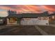 Charming single-story home featuring a colorful door and a well-maintained lawn under a beautiful sky at 1345 S Meade St, Denver, CO 80219