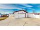 Garage with wide driveway and a shed adjacent to it at 1345 S Meade St, Denver, CO 80219