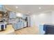 Updated kitchen featuring a stylish tile backsplash, stainless steel appliances, and butcher block countertops at 1345 S Meade St, Denver, CO 80219