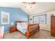Comfortable bedroom with a sloped ceiling, two windows for natural light, and carpet floors at 11363 Jersey St, Thornton, CO 80233