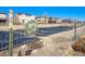 A pollinator-friendly garden with plots, surrounded by a fence and greenery in a residential area at 11363 Jersey St, Thornton, CO 80233
