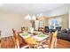 Dining room with hardwood floors and seating for six at 11363 Jersey St, Thornton, CO 80233