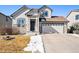 Charming two-story home with a well-maintained lawn and stone accents at 11363 Jersey St, Thornton, CO 80233