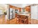 Kitchen featuring stainless steel appliances, wooden cabinets, and a center island at 11363 Jersey St, Thornton, CO 80233