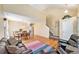 Bright living room with hardwood floors and a staircase at 11363 Jersey St, Thornton, CO 80233