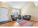 Bright living room with hardwood floors, vaulted ceiling, and a large window at 11363 Jersey St, Thornton, CO 80233