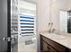 Bathroom featuring a vanity with granite counters and a shower/tub combo at 12264 Olive Way, Thornton, CO 80602