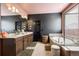Bathroom featuring dual sinks, a soaking tub, and a separate glass-enclosed shower at 12264 Olive Way, Thornton, CO 80602