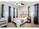 Bedroom with natural light and ceiling fan features neutral walls and decor at 12264 Olive Way, Thornton, CO 80602