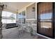Charming front porch with a swing, stone accents, and covered entrance at 12264 Olive Way, Thornton, CO 80602
