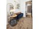 Stylish hallway with a decorative mirror, bench seating, and access to a well-appointed bathroom at 12264 Olive Way, Thornton, CO 80602