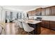 Gourmet kitchen with a large island, modern appliances, and stylish countertops at 12264 Olive Way, Thornton, CO 80602