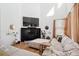 Bright living room with a cozy fireplace and large windows at 12264 Olive Way, Thornton, CO 80602