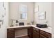 Functional home office with a built-in desk, ample storage, and a bright window for natural light at 12264 Olive Way, Thornton, CO 80602