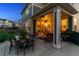 Covered patio with outdoor seating, dining, and grill perfect for entertaining guests at 12264 Olive Way, Thornton, CO 80602