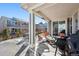 Inviting covered patio with stylish outdoor seating and a barbecue grill, perfect for outdoor gatherings at 12264 Olive Way, Thornton, CO 80602