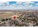 A residential neighborhood with mature trees, showcasing proximity to local amenities and parks at 1898 Wilson Cir, Erie, CO 80516