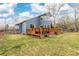 A backyard with a wooden deck, ideal for relaxing and enjoying the outdoors at 1898 Wilson Cir, Erie, CO 80516