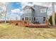 A home with a spacious backyard featuring a wooden deck perfect for outdoor entertaining at 1898 Wilson Cir, Erie, CO 80516