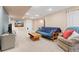 Spacious finished basement featuring a comfortable seating area and neutral carpeting at 1898 Wilson Cir, Erie, CO 80516