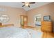 Large bedroom with hardwood floors, ensuite bathroom, and walk in closet at 1898 Wilson Cir, Erie, CO 80516