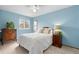 Comfortable bedroom features carpet, a ceiling fan, a window, and light-blue colored walls at 1898 Wilson Cir, Erie, CO 80516