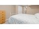 Cozy bedroom with neutral carpeting and decorative floral patterned bedspread at 1898 Wilson Cir, Erie, CO 80516