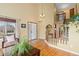 Bright entryway featuring hardwood floors, staircase and tall ceilings that provides an open feel at 1898 Wilson Cir, Erie, CO 80516