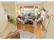 Bright living room featuring a bay window, hardwood floors, comfortable furniture, and modern décor at 1898 Wilson Cir, Erie, CO 80516